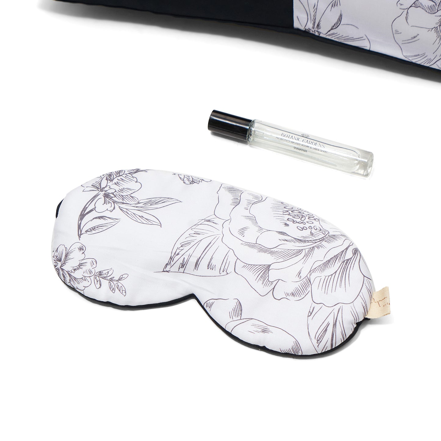 Nyana x Sukhatara Unwind Kit featuring a natural dye batik tulis silk eye mask and premium aromatherapy oil in a sustainable gift set.