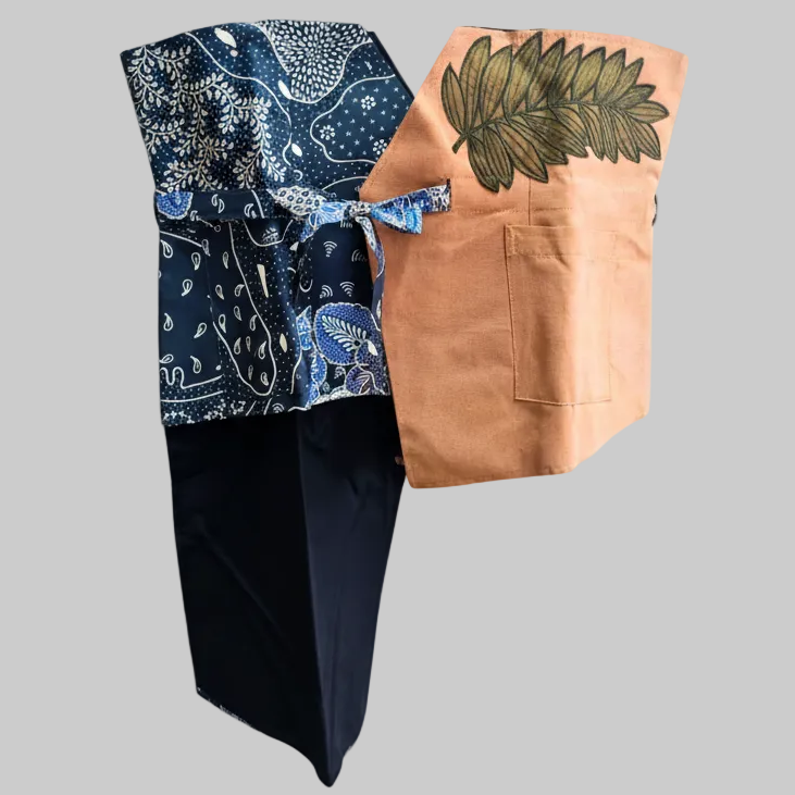 Women's sustainable obi belt featuring hand-drawn batik tulis patchwork and colorful artisanal embroidery accents.