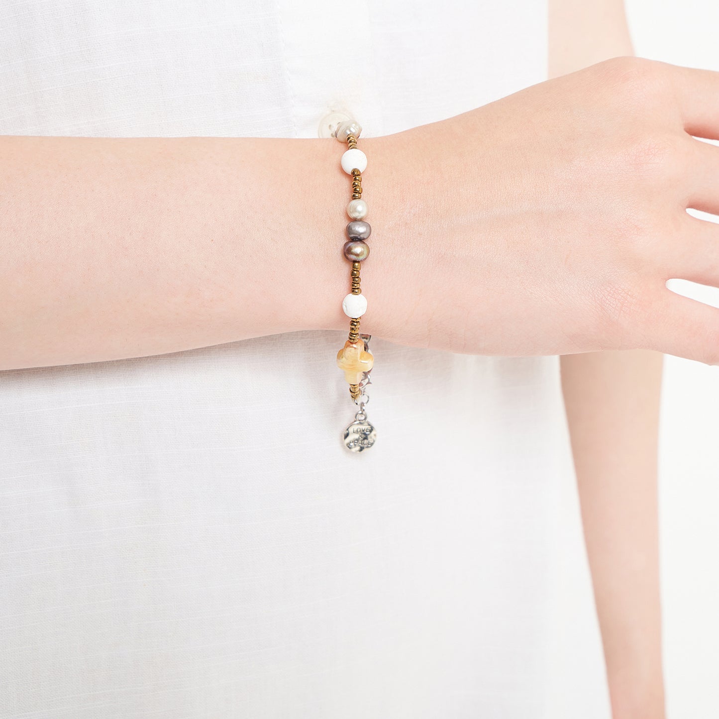 Nyana Nyana Diffuser Macrame Bracelets | Baroque pearl cross, Freshwater pearl, and lava beads