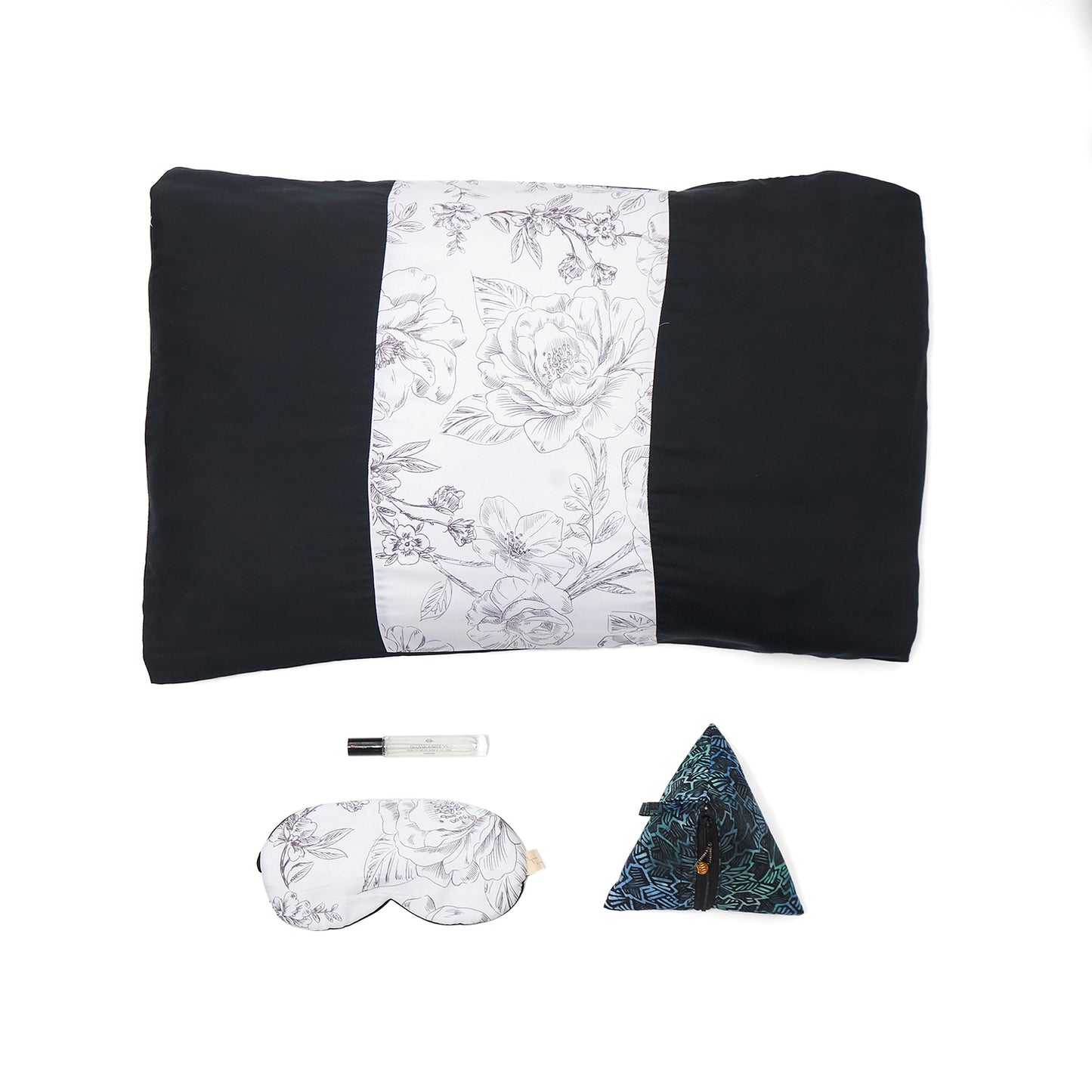 Nyana x Sukhatara Unwind Kit featuring a natural dye batik tulis silk eye mask and premium aromatherapy oil in a sustainable gift set.