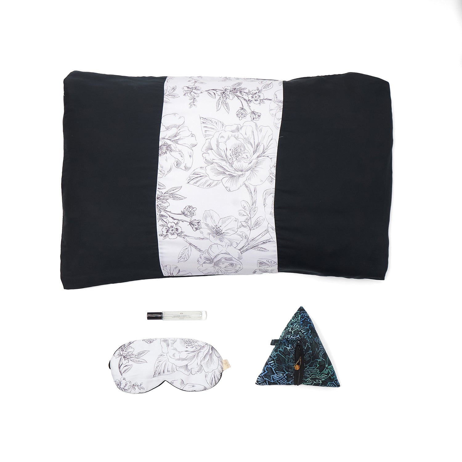 Nyana x Sukhatara Unwind Kit featuring a natural dye batik tulis silk eye mask and premium aromatherapy oil in a sustainable gift set.