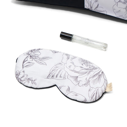 Nyana x Sukhatara Unwind Kit featuring a natural dye batik tulis silk eye mask and premium aromatherapy oil in a sustainable gift set.