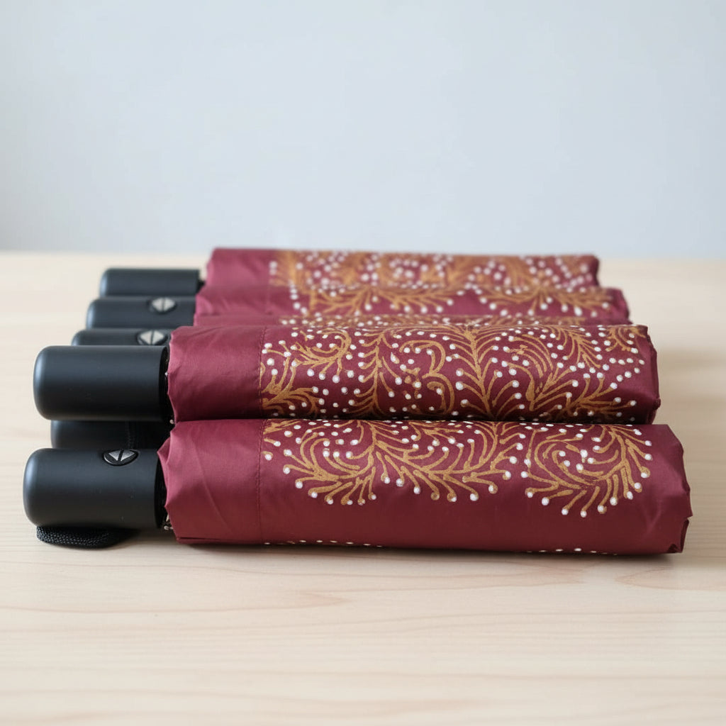 Hand-drawn Peranakan batik tulis umbrella with UV protection coating, featuring vibrant floral motifs for sun and rain protection.